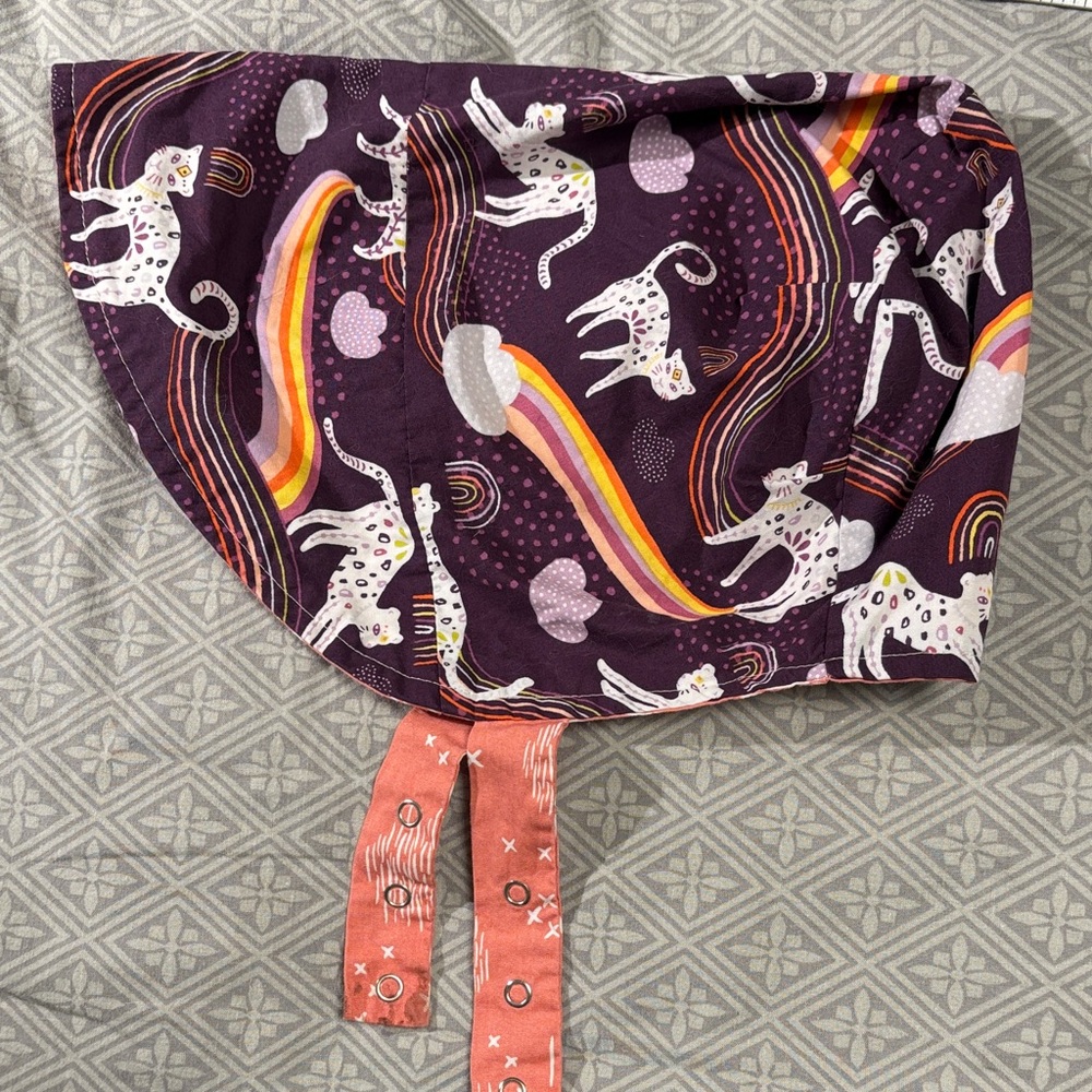 Urban baby bonnet reversible organic cotton bonnet in purple rainbow cat / pink